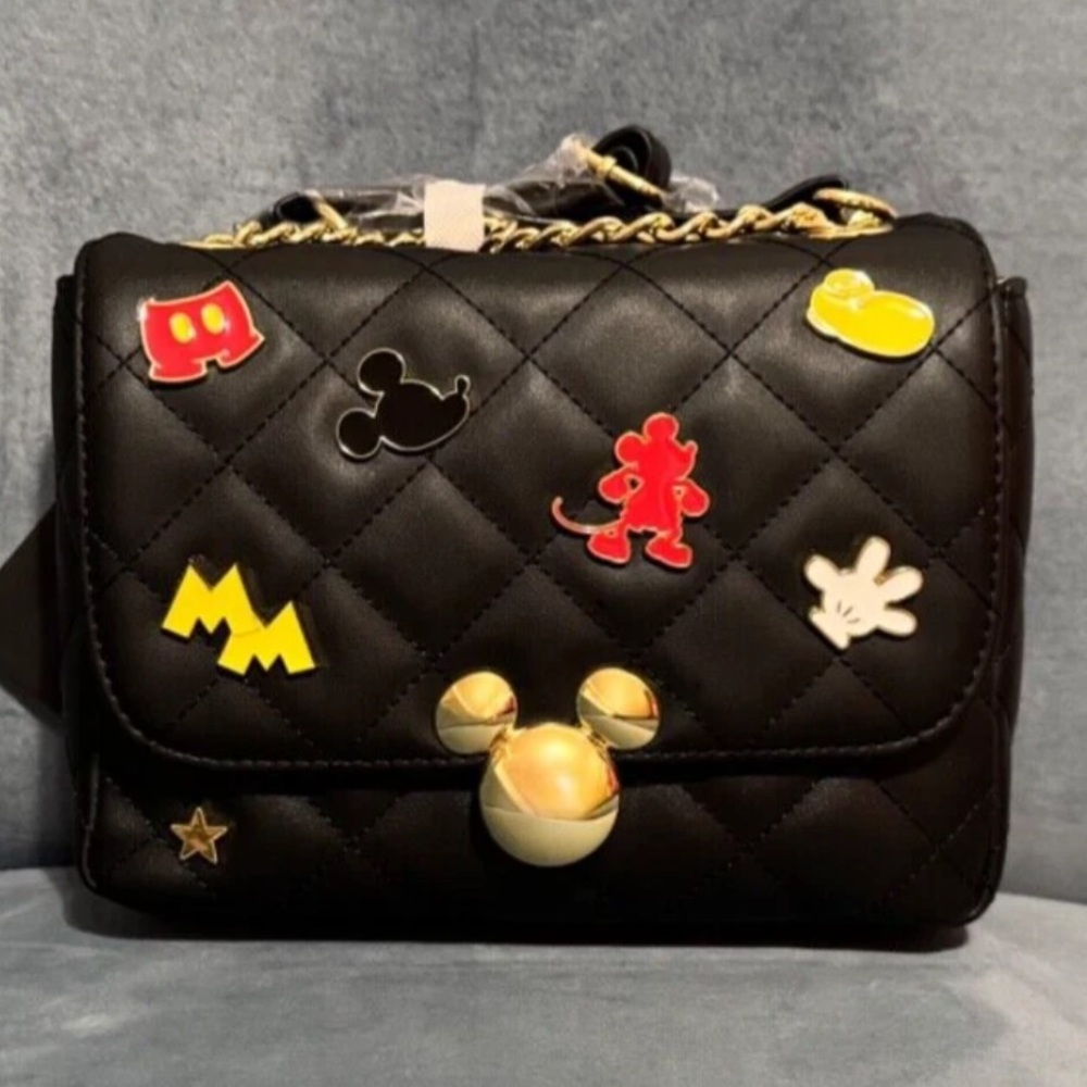 Disney Loungefly Black Quilted Bag with Mickey Mouse enamel patches.